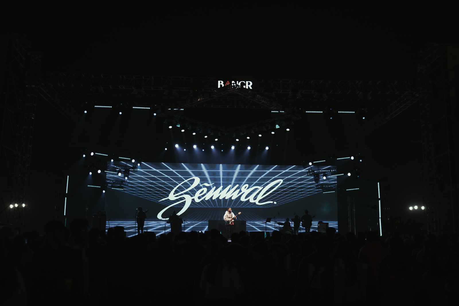 Semwal performing on a festival stage with his name across the LED screen